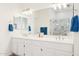 Bright bathroom with dual sinks, a large mirror, and a walk-in shower in the background at 4936 E Villa Rita Dr, Scottsdale, AZ 85254