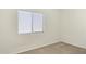 Bright and airy bedroom with a large window and neutral colored carpet at 4936 E Villa Rita Dr, Scottsdale, AZ 85254