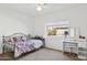 Cozy bedroom with a wrought iron bed frame, neutral carpet, and a sunny window view at 4936 E Villa Rita Dr, Scottsdale, AZ 85254