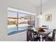 Bright dining area with a view of the sparkling pool and backyard at 4936 E Villa Rita Dr, Scottsdale, AZ 85254