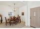 Dining room featuring a chandelier, a large wooden table and carpet flooring at 4936 E Villa Rita Dr, Scottsdale, AZ 85254