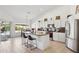 Spacious kitchen with a center island, stainless steel appliances and a view to a dining table at 4936 E Villa Rita Dr, Scottsdale, AZ 85254