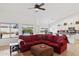 Spacious living room with vaulted ceilings, large windows, a comfortable sofa, and a view of the kitchen at 4936 E Villa Rita Dr, Scottsdale, AZ 85254