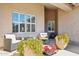 Inviting outdoor seating area with comfortable furniture and lush potted plants, perfect for relaxation at 4936 E Villa Rita Dr, Scottsdale, AZ 85254