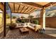 An outdoor patio area with string lights, pavers, landscaping, and outdoor furniture at 5265 S Dante --, Mesa, AZ 85212