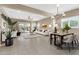 Open-concept living room featuring tile floors, chandelier, recessed lights, and elegant furniture at 5265 S Dante --, Mesa, AZ 85212
