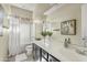 A well-lit bathroom featuring a shower and tub combination with a white vanity at 5334 S Parkwood --, Mesa, AZ 85212