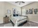 A bedroom featuring neutral walls, a queen size bed, and an accent chair at 5334 S Parkwood --, Mesa, AZ 85212