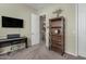 Neutral bedroom featuring a piano, TV, bookshelf, and doorway to the rest of the home at 5334 S Parkwood --, Mesa, AZ 85212