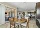 Breakfast nook leading to outdoor covered patio & view of open-concept kitchen at 5334 S Parkwood --, Mesa, AZ 85212