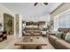 Spacious living room featuring tile floors and views into the kitchen and dining area at 5334 S Parkwood --, Mesa, AZ 85212