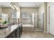 Main bathroom boasts double sinks, granite countertops and separate tub and shower at 5334 S Parkwood --, Mesa, AZ 85212