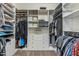 Organized walk-in closet with ample shelving, drawers, and hanging space for clothes and accessories at 5334 S Parkwood --, Mesa, AZ 85212