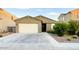 Charming single-story home featuring a well-manicured front yard and an attached two-car garage at 559 W Magena Dr, San Tan Valley, AZ 85140