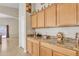 Kitchen counter and cabinets with a view to Gathering room at 5653 E Athena Rd, Florence, AZ 85132