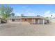 Backyard view highlighting the covered patio at 707 N 92Nd Pl, Mesa, AZ 85207