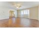 Spacious living room offers wood flooring, recessed lighting, and a view of the bright bay window at 707 N 92Nd Pl, Mesa, AZ 85207