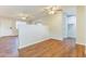 Airy living room with hardwood floors, recessed lighting, and great flow to other rooms in the home at 707 N 92Nd Pl, Mesa, AZ 85207