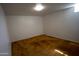 Bedroom featuring warm-toned carpet, panelled walls, and a simple ceiling light at 7420 W Cinnabar Ave, Peoria, AZ 85345