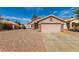 Exterior view of home featuring desert landscaping and attached two-car garage at 7808 W Palo Verde Dr, Glendale, AZ 85303
