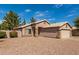 Well-maintained single-story home with desert landscaping and tan exterior paint at 7808 W Palo Verde Dr, Glendale, AZ 85303