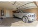 Spacious two-car garage featuring a full-size pickup truck at 7808 W Palo Verde Dr, Glendale, AZ 85303