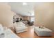 Connected living and kitchen areas with ceiling fans and an open layout at 7808 W Palo Verde Dr, Glendale, AZ 85303