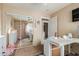 Home office with mirrored closet doors and adjacent bathroom at 7808 W Palo Verde Dr, Glendale, AZ 85303