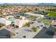 Community aerial view features tennis courts, a pool, and a lush green lawn at 8118 E Medina Ave, Mesa, AZ 85209
