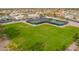 Aerial view featuring pickleball courts, open green space, and community amenities at 8118 E Medina Ave, Mesa, AZ 85209