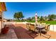 Back patio features outdoor seating with views of the well-manicured golf course at 8118 E Medina Ave, Mesa, AZ 85209