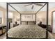 Primary bedroom features a large bed, ceiling fan, and two nightstands at 8118 E Medina Ave, Mesa, AZ 85209