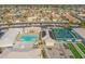 Aerial view of a pool, pickleball courts and bocce ball courts located in the community at 8118 E Medina Ave, Mesa, AZ 85209