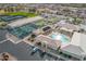 Aerial view of community center with a pool, bocce ball and shuffleboard courts, and pickleball courts at 8118 E Medina Ave, Mesa, AZ 85209