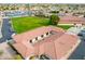 Elevated shot of community center with landscaped surroundings, parking, and manicured lawn at 8118 E Medina Ave, Mesa, AZ 85209