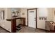 Bright foyer featuring tile flooring, a decorative front door, and custom woodworking details at 8118 E Medina Ave, Mesa, AZ 85209
