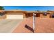 Inviting single-story home featuring a well-maintained brick exterior, a two-car garage, and desert landscaping at 8118 E Medina Ave, Mesa, AZ 85209