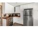 Kitchen features white cabinets, stainless appliances, and a wine fridge at 8118 E Medina Ave, Mesa, AZ 85209