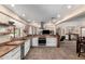 A spacious kitchen features butcher block counters, stainless appliances, and an open floorplan at 8118 E Medina Ave, Mesa, AZ 85209