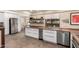 Bright kitchen with stainless steel appliances, white cabinetry, and butcher block countertops at 8118 E Medina Ave, Mesa, AZ 85209