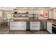 Bright kitchen with stainless steel appliances, white cabinetry, and butcher block countertops at 8118 E Medina Ave, Mesa, AZ 85209