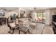 Spacious living room with a view to the backyard patio with an open layout to the kitchen at 8118 E Medina Ave, Mesa, AZ 85209
