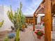 Picturesque backyard with patio, fire pit, and desert flora creating an oasis at 8720 E Via De Dorado --, Scottsdale, AZ 85258