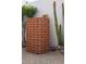 The backyard features a decorative brick design and desert landscaping at 8720 E Via De Dorado --, Scottsdale, AZ 85258