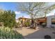Lush backyard highlighting the garden, wooden pergolas, cacti, and privacy walls at 8720 E Via De Dorado --, Scottsdale, AZ 85258