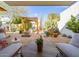 Beautiful backyard features a covered patio, desert landscaping, and tranquil pergola at 8720 E Via De Dorado --, Scottsdale, AZ 85258