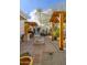 Expansive backyard with outdoor kitchen, fire pit, and lush desert landscaping at 8720 E Via De Dorado --, Scottsdale, AZ 85258