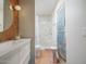 Bright bathroom featuring a modern vanity, terracotta tile accents, and a walk-in shower for a luxurious feel at 8720 E Via De Dorado --, Scottsdale, AZ 85258