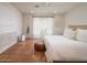 Cozy bedroom with terracotta floors, white linens, and natural light creating a peaceful retreat at 8720 E Via De Dorado --, Scottsdale, AZ 85258