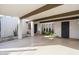 Open carport area with modern design elements, desert landscaping, and convenient access to the home at 8720 E Via De Dorado --, Scottsdale, AZ 85258